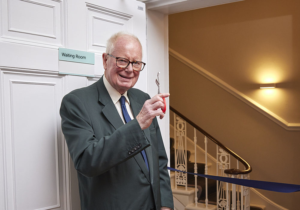 Hamish Leslie Melville, chairman of The London Clinic, cuts the ceremonial ribbon